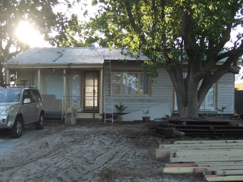 Before photo - house with bare front yard