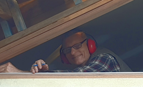 Man in triangle window